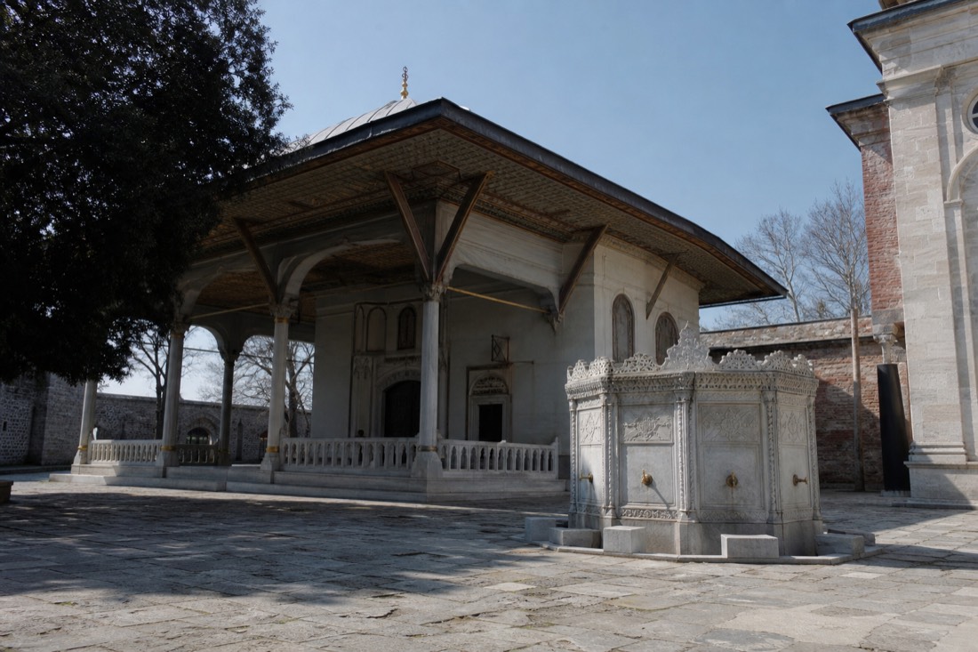 The ornate Audience Chamber pavilion with wide eaves and a fountain in the third courtyard of Topkapı Palace