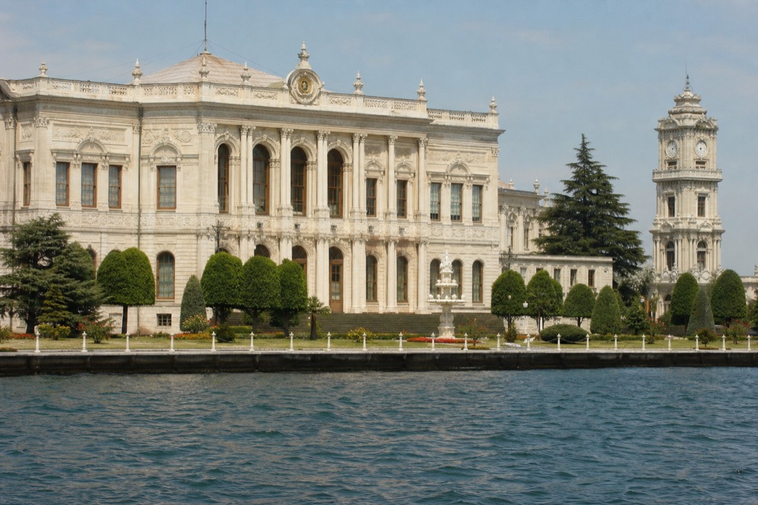 The ornate waterfront facade and gate of Dolmabahce Palace on the Bosphorus in Istanbul
